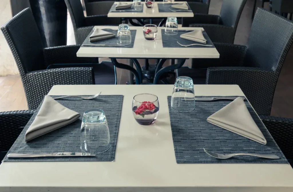 Outdoor dinner table set by Caluco